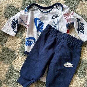 Nike navy blue onesie with navy pants, Nike logo, baby matching set